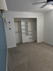 Castle Rock bedroom with accent wall and closet finish