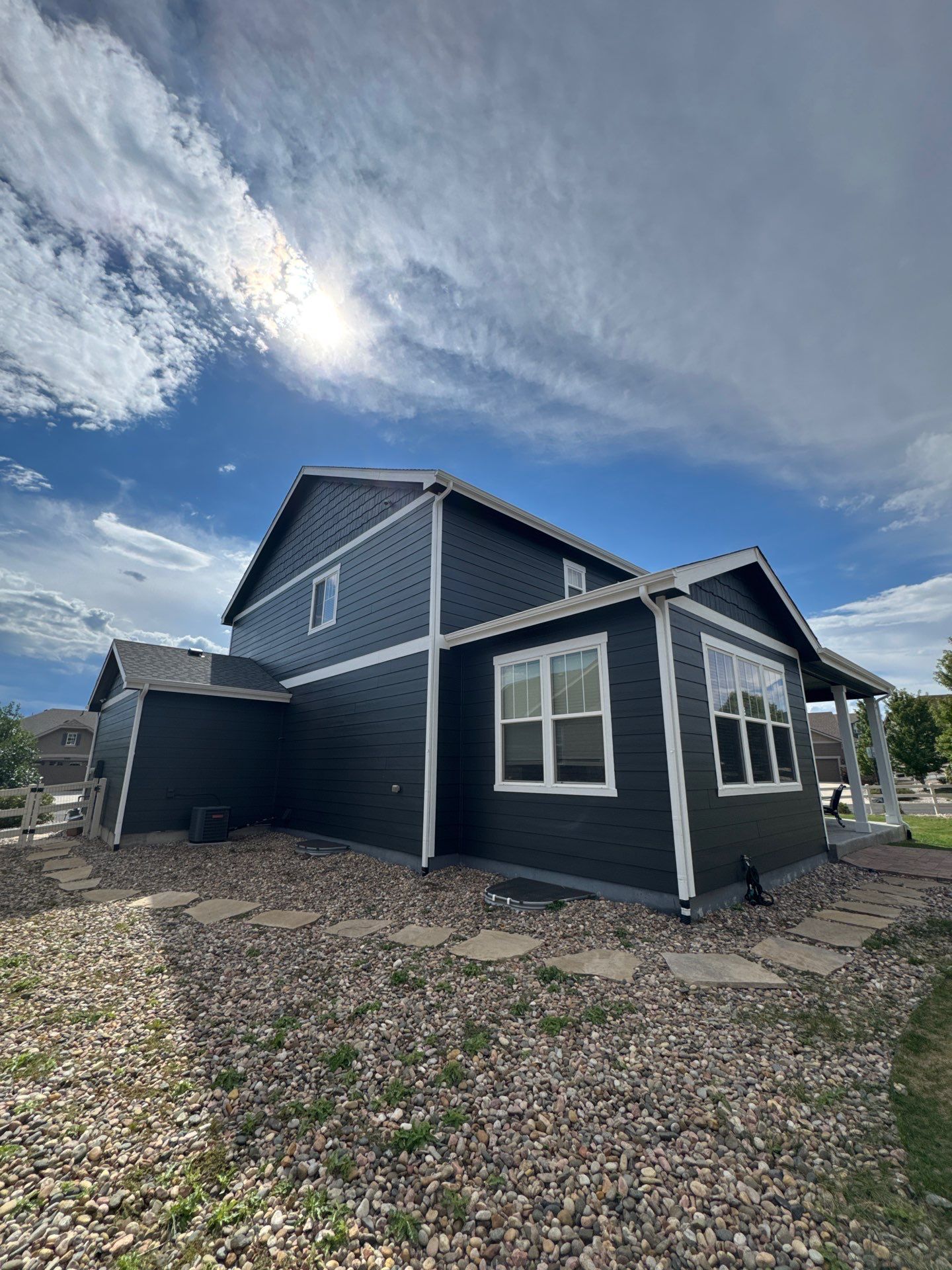 After — Castle Rock exterior with high-contrast siding and white trim