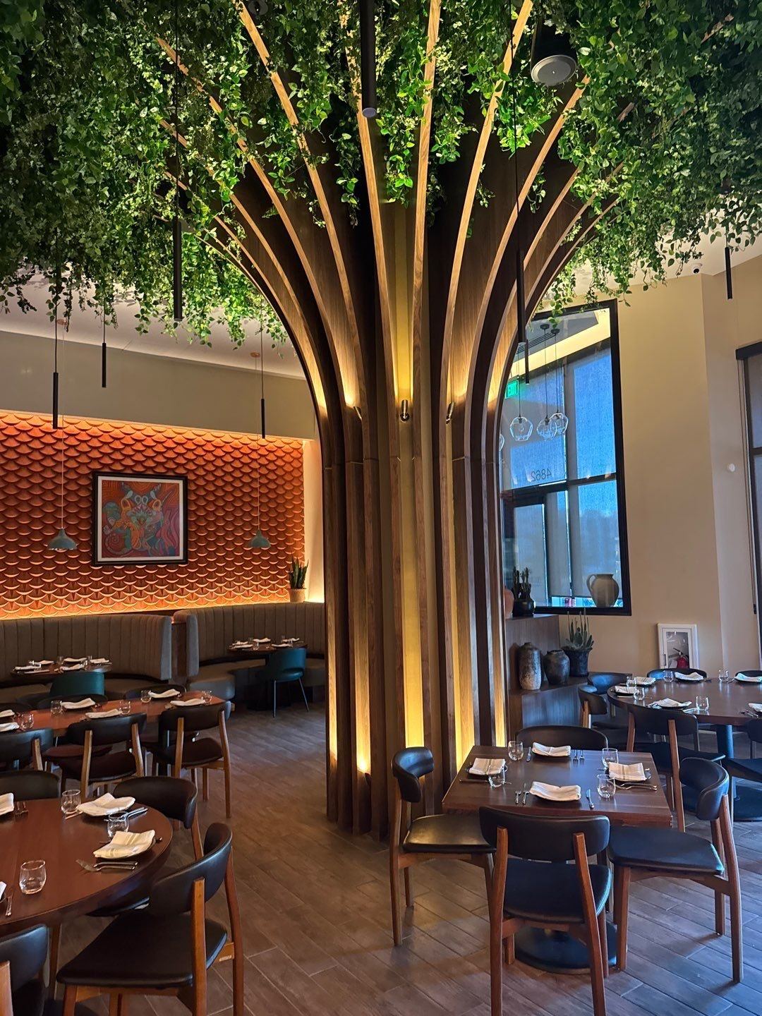 Wood tree column and painted dining room walls at El Tule restaurant in the Denver Tech Center