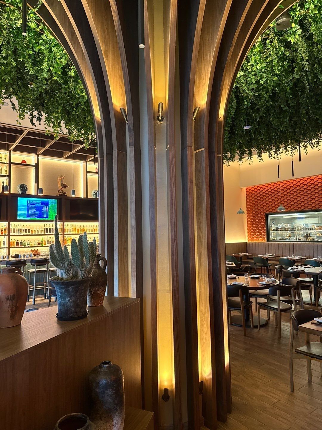 View through the wood column into the painted dining room at El Tule restaurant
