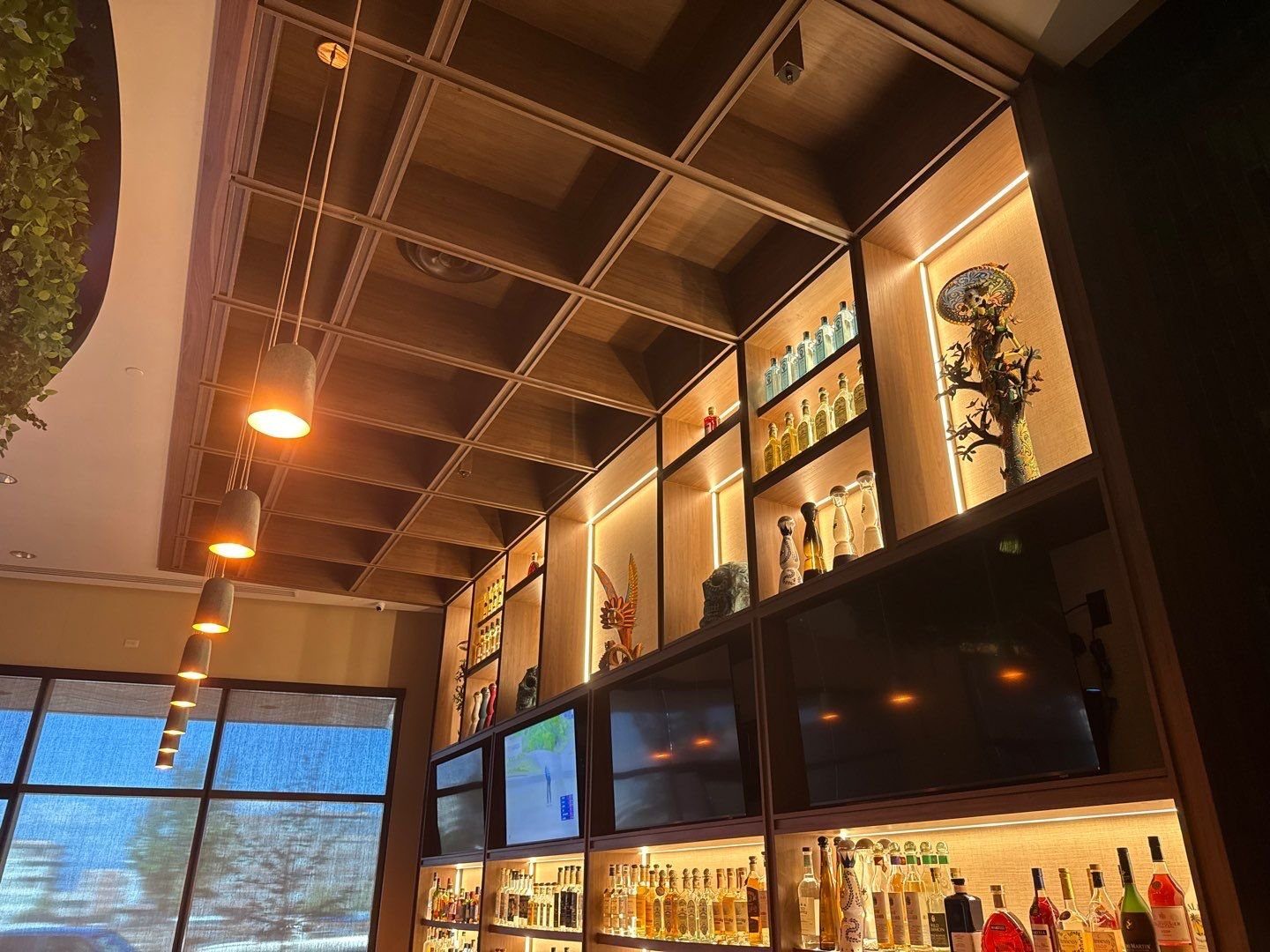 Painted bar ceiling and back-bar shelving at El Tule restaurant